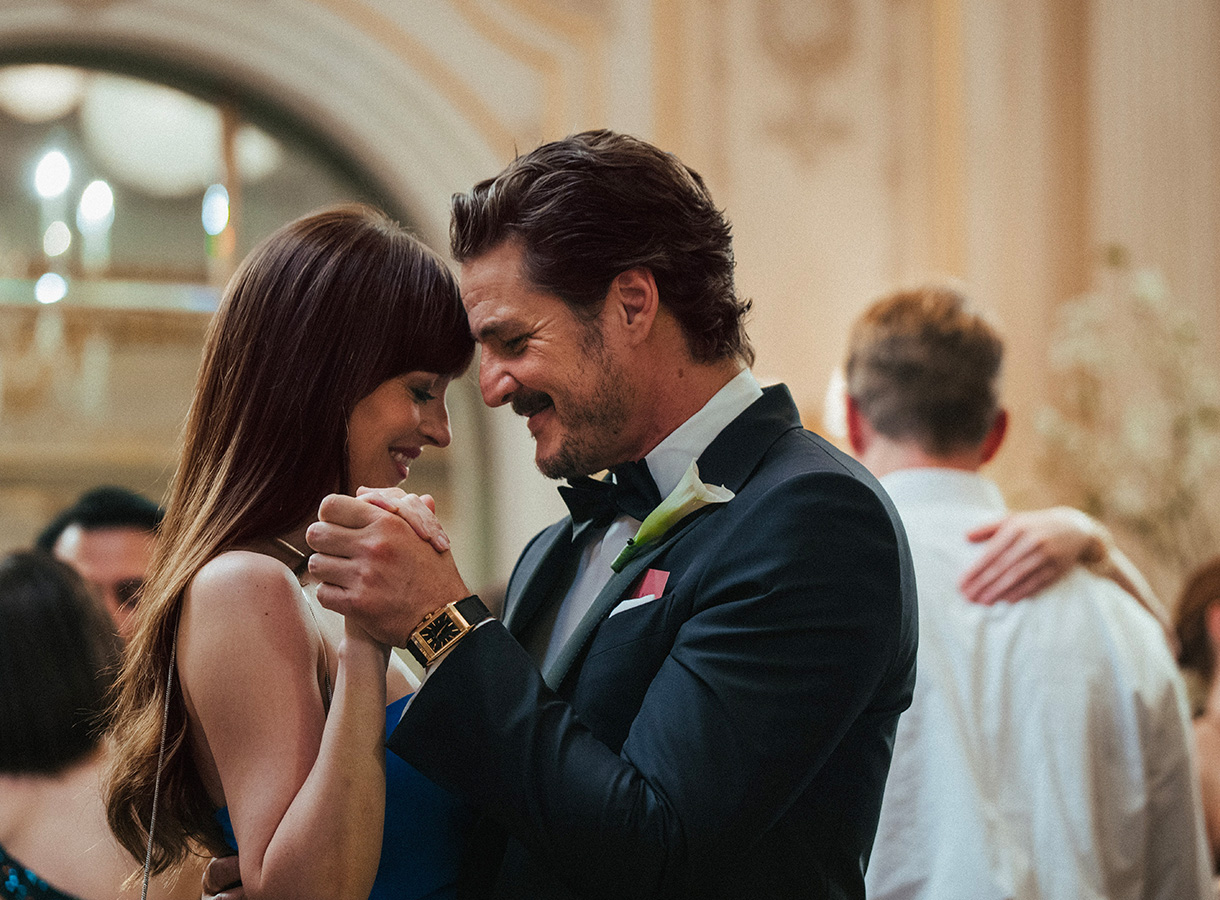 A man and woman in formal wear dancing at a formal gathering